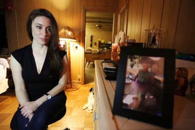 Casey Anthony Looks at Photo of Daughter Caylee