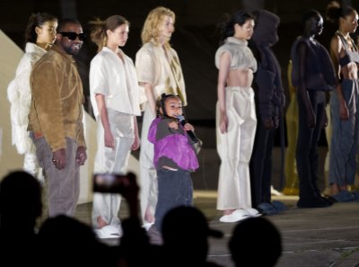 North West and Kanye West On Stage at Yeezy Fashion Show in Paris 