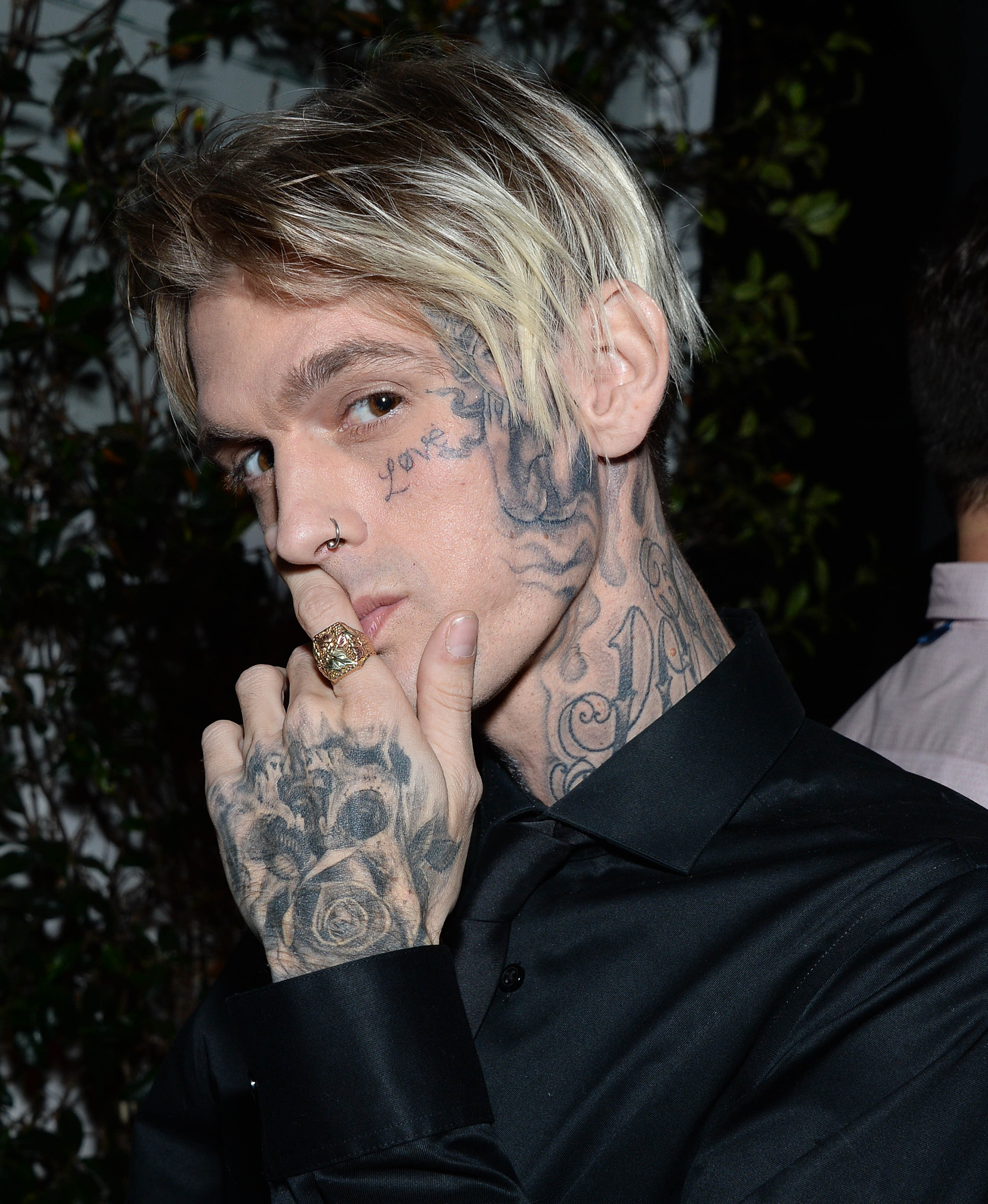 Aaron Carter shows off giant face tattoo in honor of late sister