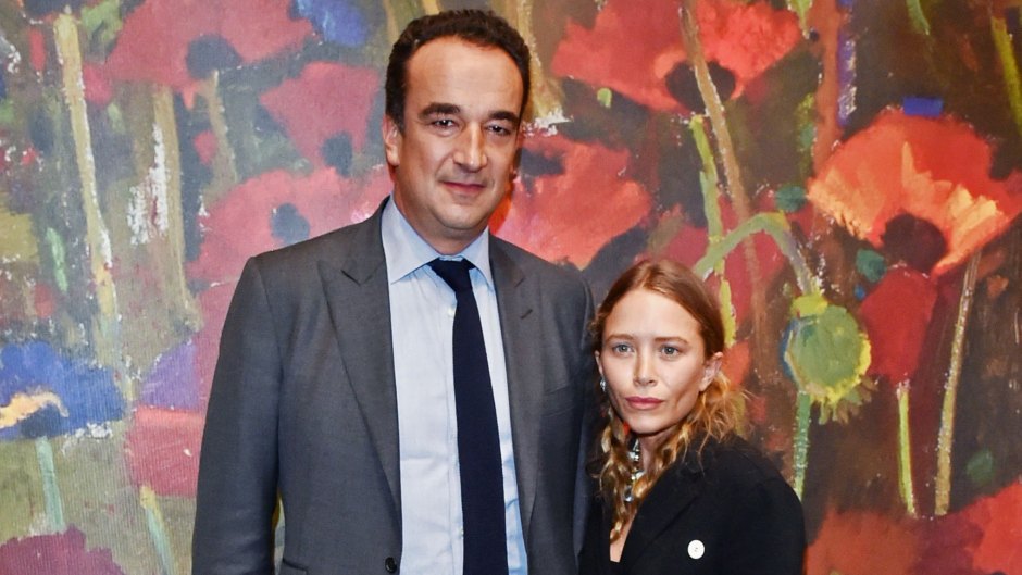 Mary-Kate Olsen Wears Baggy Black Coat With and Ex Husband Olivier Sarkozy in a Grey Suit at Event