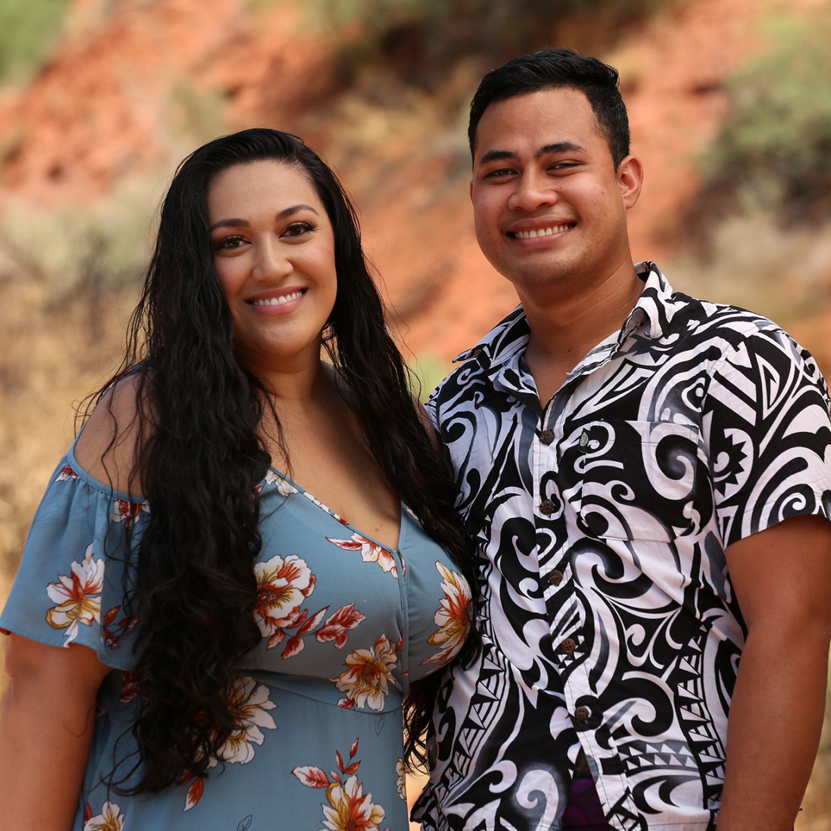 A picture of Kalani and Asuelu, with Kalani wearing a maroon and cream checkered shirt and Asuelu wearing a navy t-shirt.