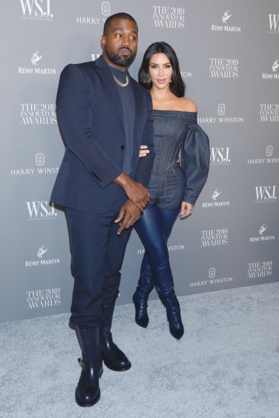 Kim Kardashian Holding Husband Kanye West's Arm