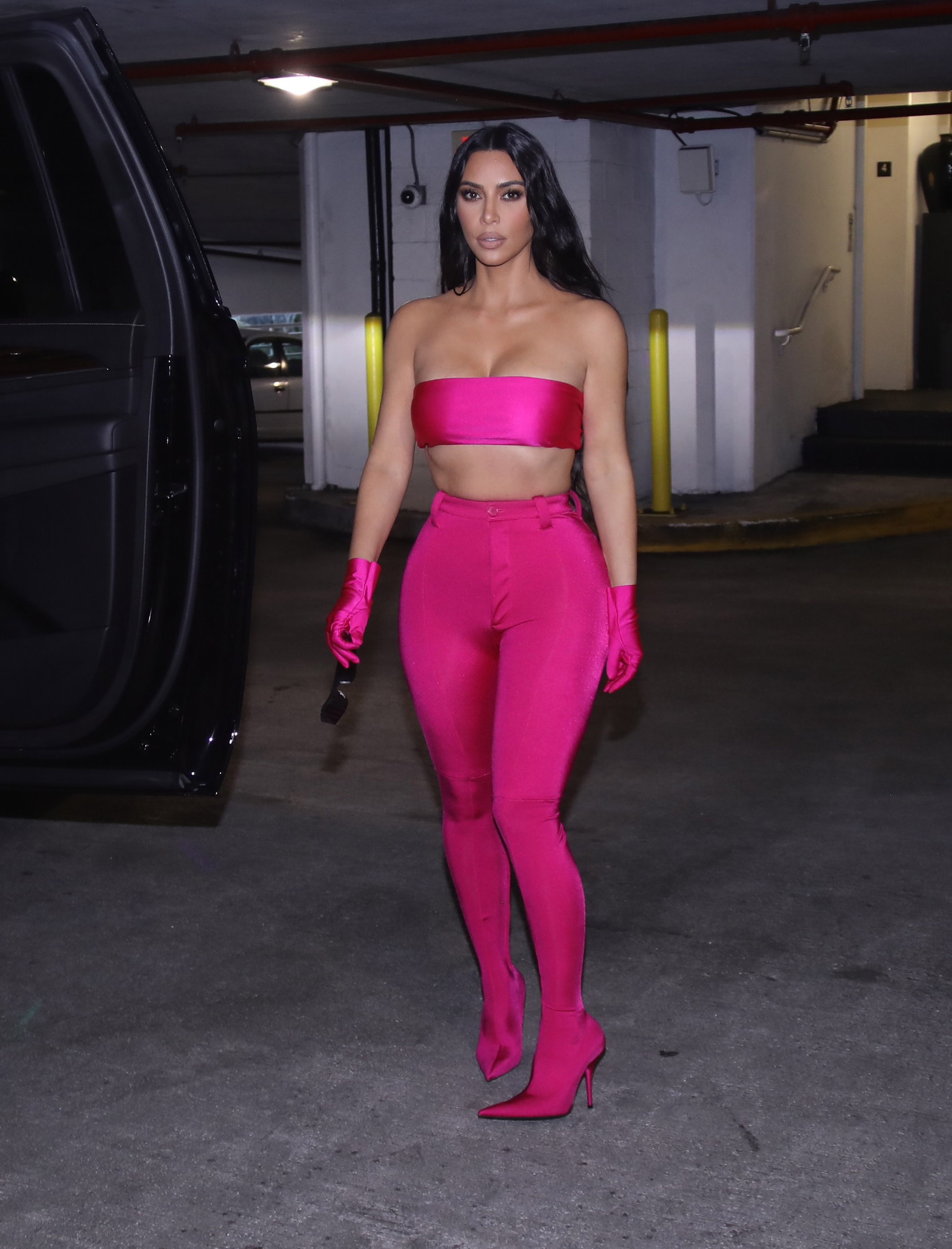 Kim Kardashian Wears Hot Pink Crop Top, Pants in Miami