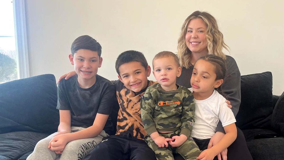Kailyn Lowry on a couch with sons Isaac, Lincoln, Creed and Mello.
