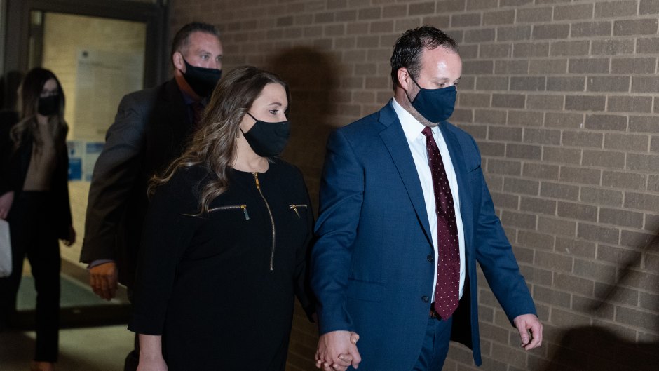 Josh Duggar and Anna holding hands outside courthouse