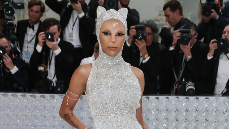 Doja Cat wears white dress and cat prosthetics at the Met Gala 2023