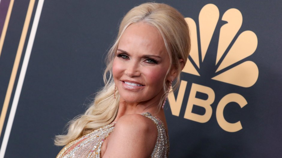 Kristin Chenoweth looks over her shoulder and smiles in a gold dress