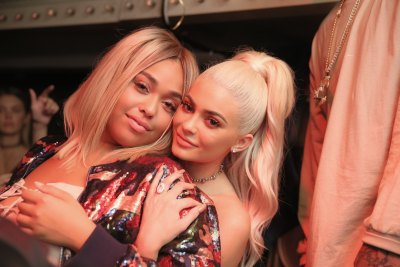 Jordyn Woods and Kylie Jenner hugging while posing for a picture together