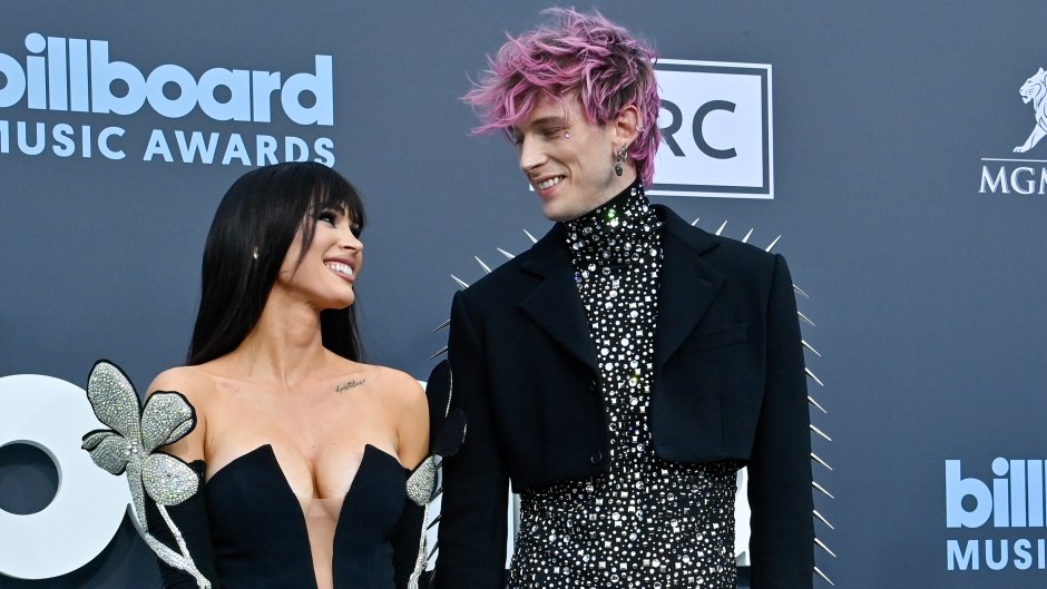 Megan Fox and Machine Gun Kelly smile at one another on the red carpet
