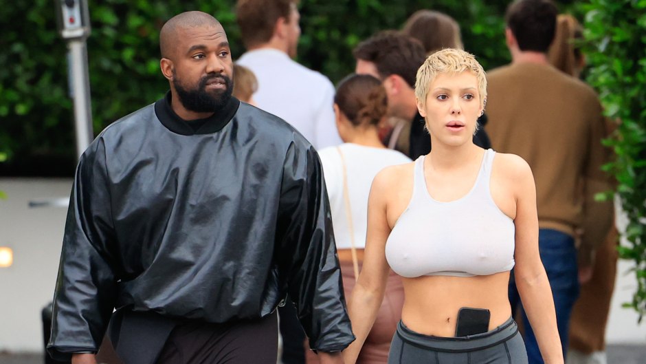 Bianca Censori holds hands while walking with Kanye West.