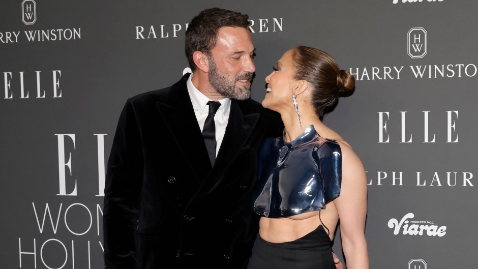 Ben Affleck and Jennifer Lopez smile at one another in a photo taken at ELLE's Women In Hollywood Celebration