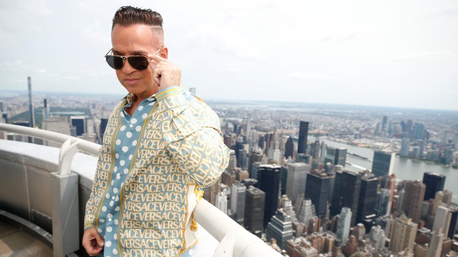 Jersey Shore star Mike Sorrentino wears sunglasses and a button down shirt on the top of the Empire State Building