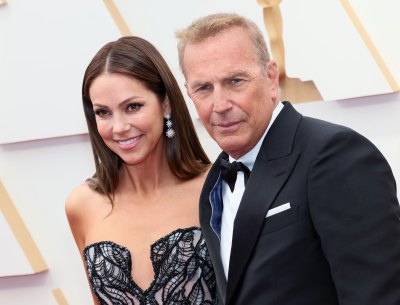Kevin Costner and Christine Baumgartner pose for a photo at the 94th Annual Academy Awards