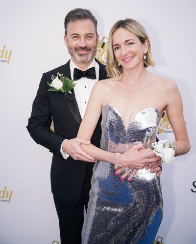 Jimmy Kimmel and Molly McNearney pose for a photo in a formal attire