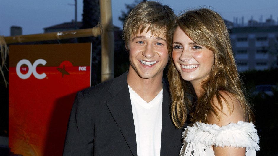 Mischa Barton and Ben McKenzie pose for a photo at The O.C. kickoff party in 2003
