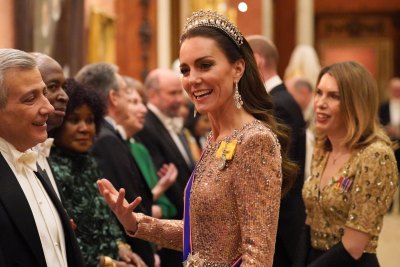 Kate Middleton wearing a crown and a formal gown