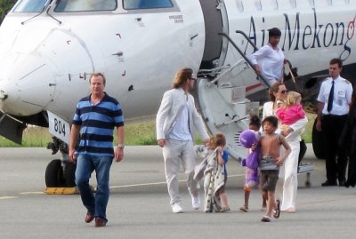 Angelina Jolie and Brad Pitt get off a plane with their children at the Con Son Airport on Con Dao island