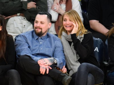Benji Madden and Cameron Diaz attend a basketball game